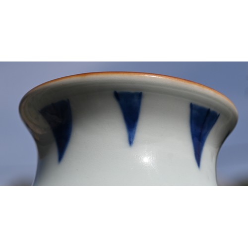 441 - A Chinese Transitional style blue and white sleeve vase, painted in rich tones of underglaze blue wi... 