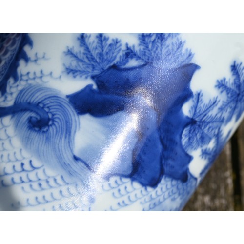 441 - A Chinese Transitional style blue and white sleeve vase, painted in rich tones of underglaze blue wi... 