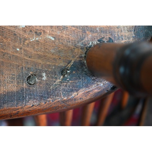 892 - An antique yew and elm Windsor high splat-back armchair, Lincolnshire, with crinoline stretcher