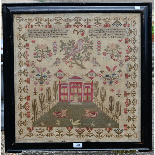 1094 - A George IV demi-point and crossstitch sampler, worked with religious verse, above a parrot in a tre... 