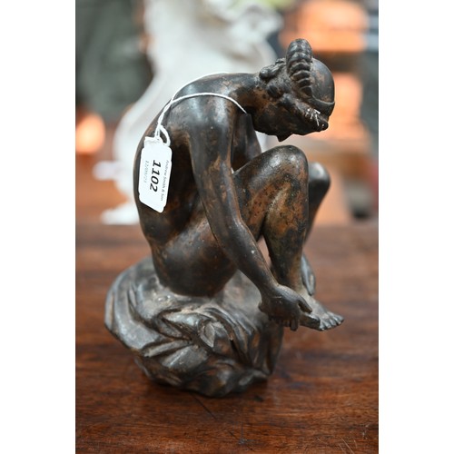 1102 - A patinated bronze nude study of a bather, unsigned, 21.5 cm high, after a renaissance bronze in the... 