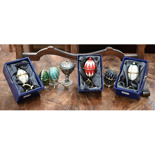 165 - Six Atlas Editions Fabergé eggs (three boxed) to/w an urn and an egg pendant (8)