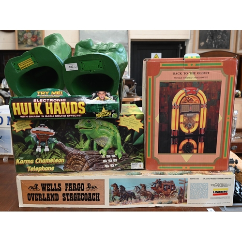 182 - A boxed pair of electronic Hulk Hands to/w a Karma Chameleon automated novelty telephone, novelty ju... 