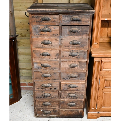 31 - An antique stained pine twenty drawer chest, ex shop fitting, with cast metal fittings (one missing)... 