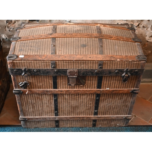 14 - Crouch & Fitzgerald, New York, two late 19th/20th century dome top travel trunks, with stiped ca... 