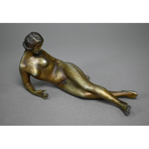 114 - An Art Deco-style bronzed female reclining nude in the manner of Lorenzl (unsigned), 8 x 16 cm