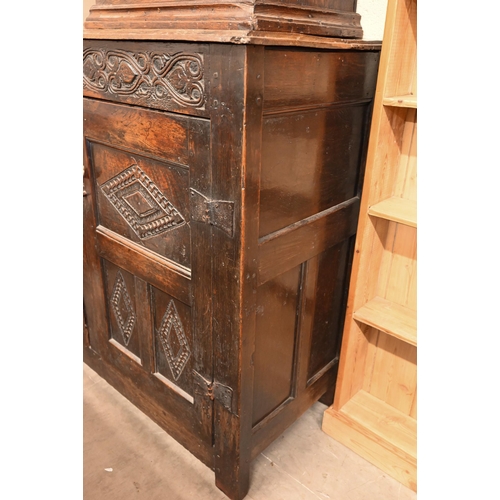 262 - An antique carved oak cupboard with panelled doors (a/f), 135 x 55 x 115 cm high