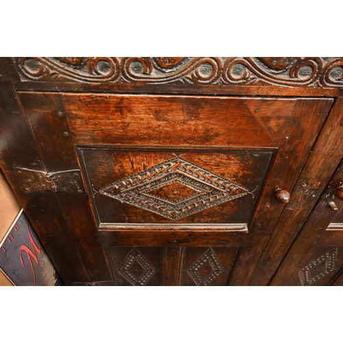 262 - An antique carved oak cupboard with panelled doors (a/f), 135 x 55 x 115 cm high