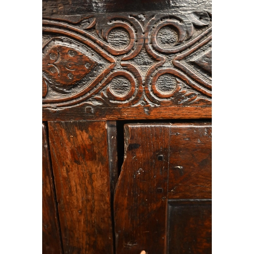 262 - An antique carved oak cupboard with panelled doors (a/f), 135 x 55 x 115 cm high