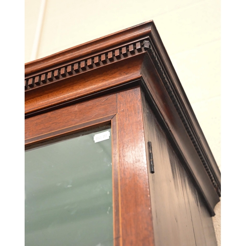 269 - A 19th century mahogany cabinet bookcase with glazed doors over panelled cupboards on bracket feet, ... 