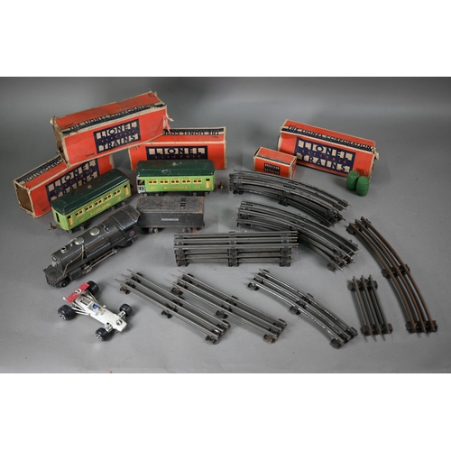 122 - # A US Lionel Corporation 0 Gauge electric 2-4-2 locomotive with tender to/w two Pullman coaches and... 