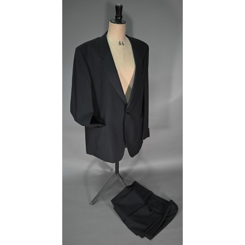 129 - # A Varteks International L48 gent's black dinner jacket and trousers, size L50; a black wool short ... 