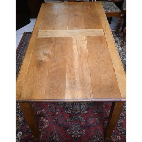 245 - A small oak dining table raised on square tapering legs, 179 cm x 87 cm x 73 cm h