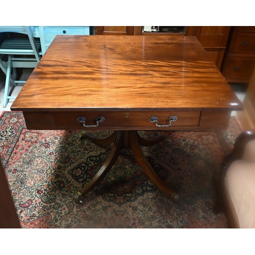 230 - A Victorian and later square top double sided library table, with drawer to two sides, raised on a t... 