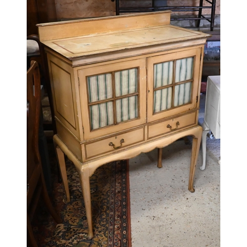 239 - A vintage Italian painted cabinet, with glazed doors over two drawers and raised on cabriole support... 