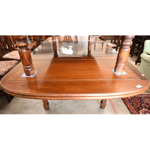 253 - A mahogany draw-leaf extending table on tapering square supports, 195 x 105 x 75 cm high