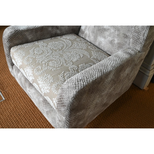 255 - A contemporary grey/brown upholstered armchair, raised on beech legs