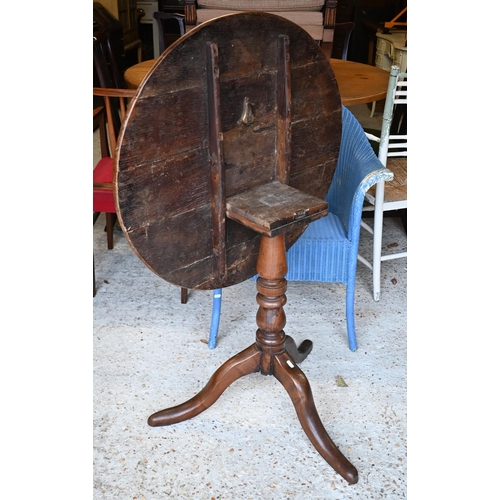 455 - An 18th century oak tilt top tripod table, 74 cm dia. x 71 cm h