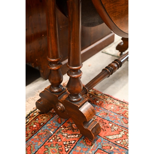 436 - A Victorian mahogany Sutherland table with turned gate-leg action supports