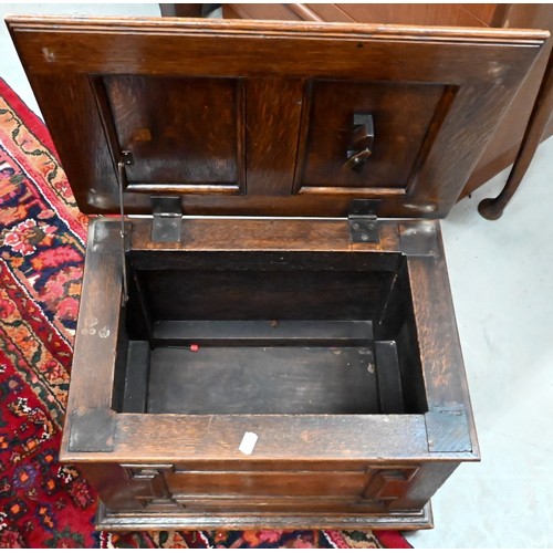 445 - A panelled oak slipper/coal box on bun feet, 50 x 36 x 36 cm h