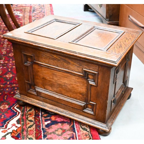 445 - A panelled oak slipper/coal box on bun feet, 50 x 36 x 36 cm h