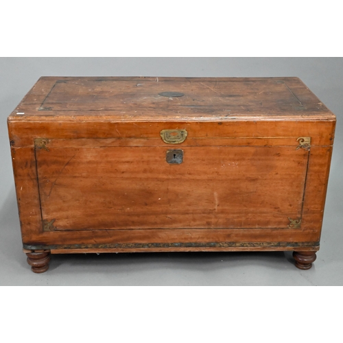 464 - A late 19th century part brass inlaid camphorwood campaign trunk, raised on turned feet, brass handl... 