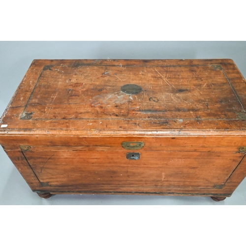 464 - A late 19th century part brass inlaid camphorwood campaign trunk, raised on turned feet, brass handl... 