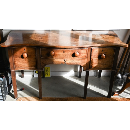 466 - # A 19th century mahogany serpentine sideboard with three drawers raised on square tapering supports... 