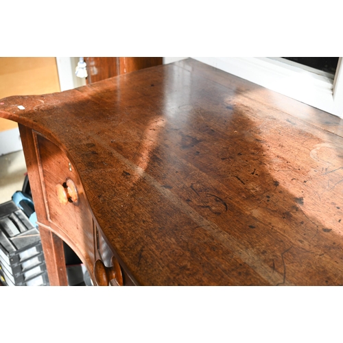 466 - # A 19th century mahogany serpentine sideboard with three drawers raised on square tapering supports... 