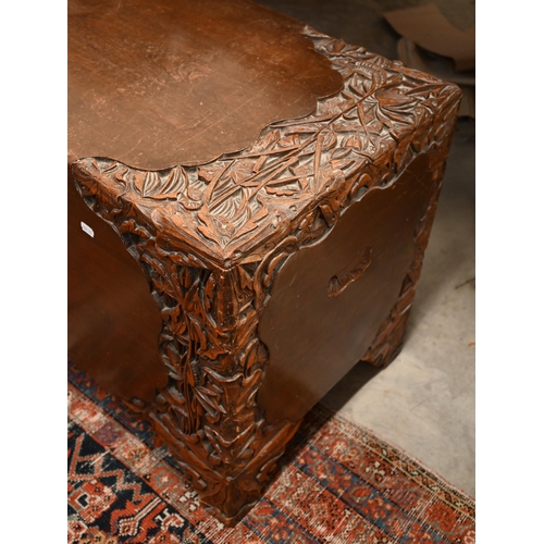 467 - A large Chinese carved hardwood and brass bound blanket chest, camphor-lined interior, 100cm wide x ... 