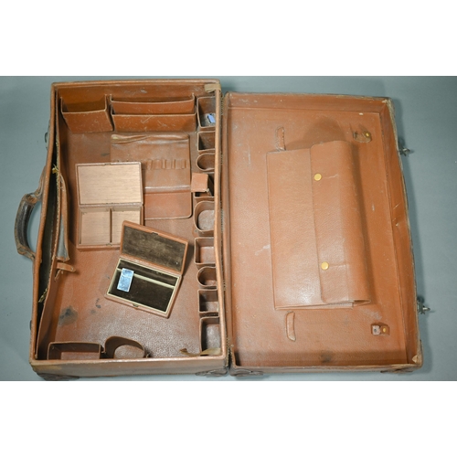 191 - A vintage pigskin suitcase with fitted interior