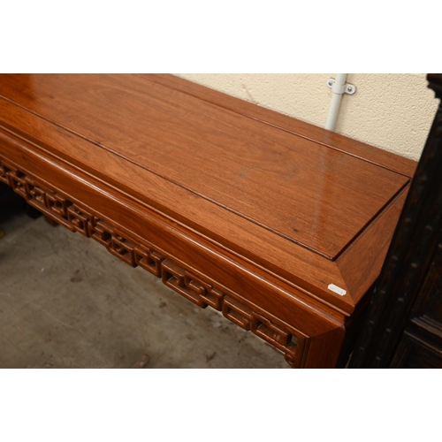 366 - A Chinese hardwood console table with pierced frieze, straight legs with square key-fret feet, 138 x... 