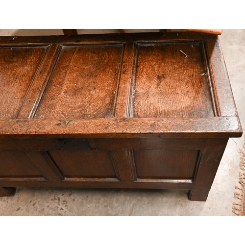 476 - An antique oak blanket chest/ coffer of panelled construction with hinged top, 105 cm wide x 54 cm d... 