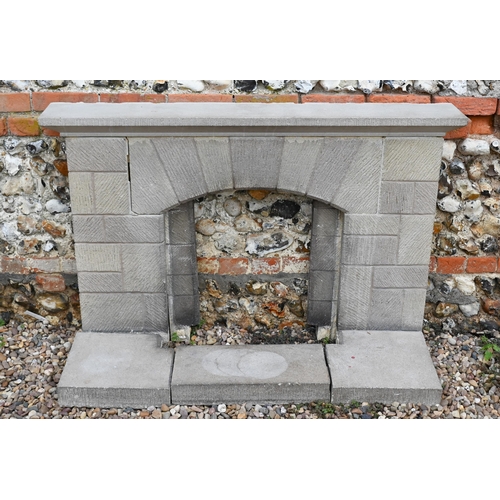 10 - A cast stone fire surround with hearth, 92h x 135cm w o/a