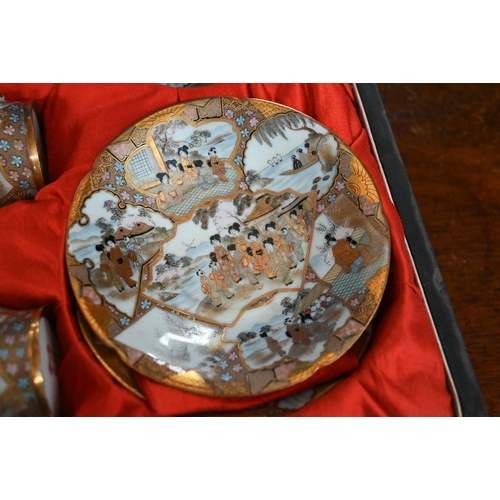 137 - A late 19th century Japanese cased set of six eggshell porcelain cups and saucers, finely-painted an... 