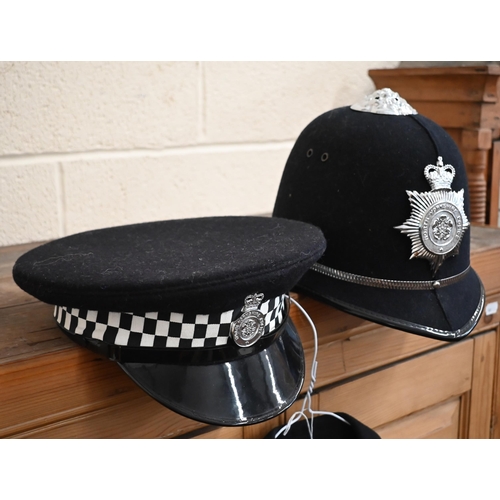 140 - A North Yorkshire policeman's uniform comprising helmet, peaked cap, tunic, trousers and truncheon