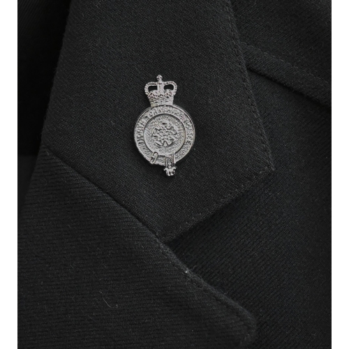 140 - A North Yorkshire policeman's uniform comprising helmet, peaked cap, tunic, trousers and truncheon