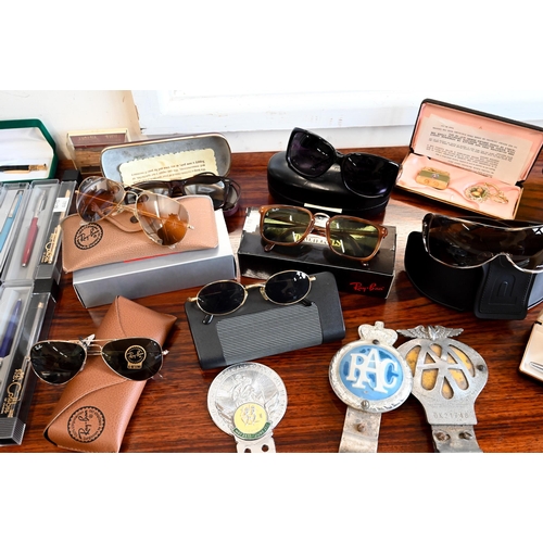 152 - Various sunglasses including Ray Ban, Police, etc to/w various pens, car badges etc