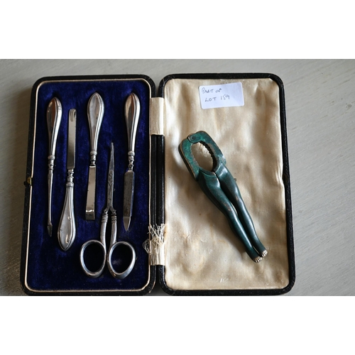 159 - A cased silver-mounted manicure set, Birmingham 1911, to/w various nutcrackers and picks including p... 