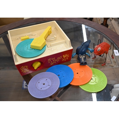 165 - # A vintage Fisher-Price plastic Music Box Record Player with five 'records' to/w a Tri-ang clockwor... 