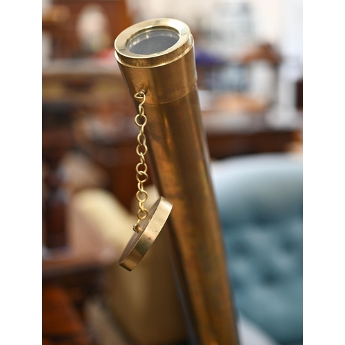 176 - A reproduction brass telescope, 100 cm long, on adjustable wooden tripod