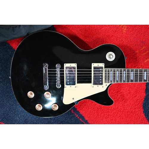 182 - A 'Gear 4 Music' Gibson (Les Paul shape) electric guitar (black body with cream trim) to/w Ritter so... 