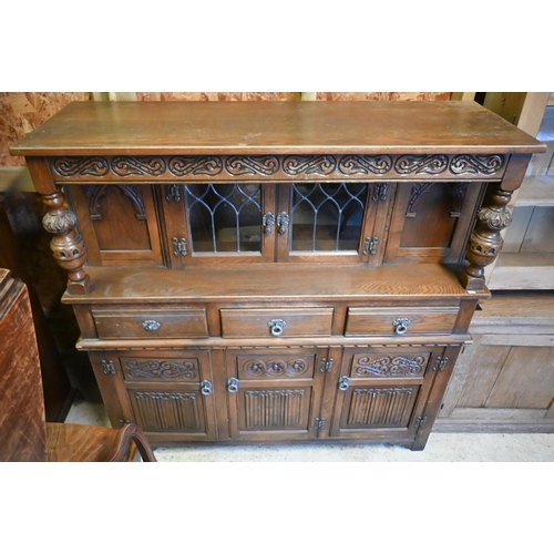 199 - A vintage Old Charm part lead glazed and linenfold panelled carved oak court cupboard, 138 cm x 47 c... 