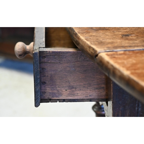 200 - An antique oak gateleg table with single drawer to one end, later toes, 107 cm (136 cm open) x 46 cm... 