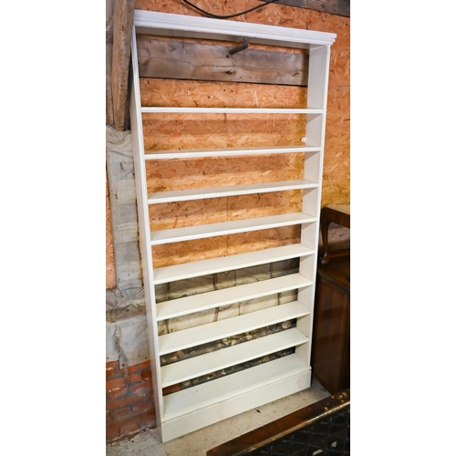 210 - A narrow painted (pine ?) nine shelf open bookcase, 110 cm x 17 cm x 227 cm