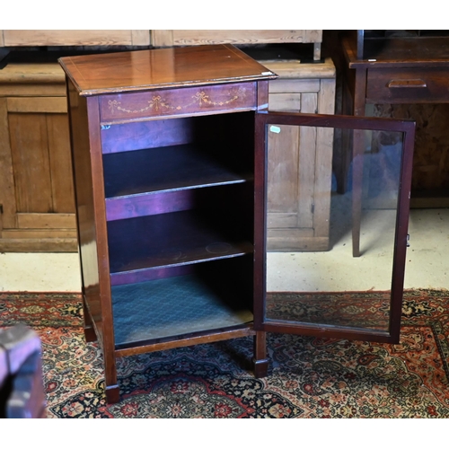 215 - A Sheraton revival inlaid satinwood music cabinet, with single glazed door, on square spade end legs... 