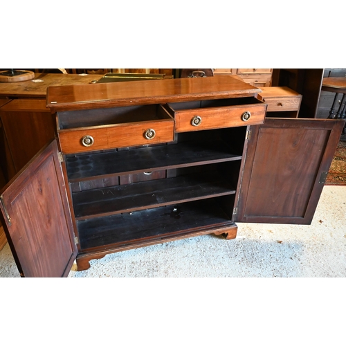 222 - A two door mahogany cabinet, with pair of frieze drawers over twin beaded panel doors, on shaped bra... 