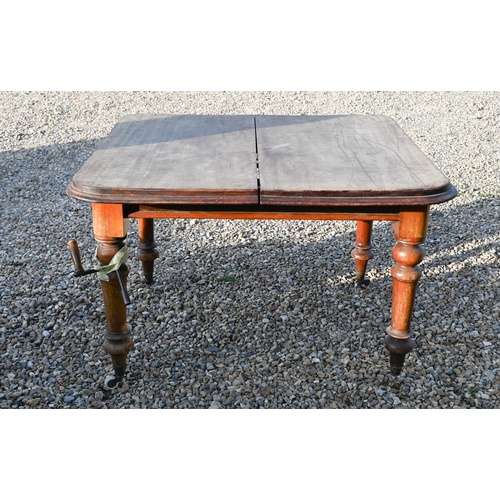 232 - # A Victorian mahogany extending wind-out dining table, with insert leaf and winding handle, raised ... 