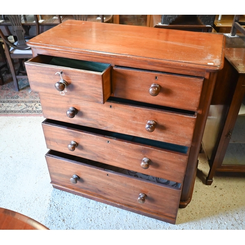 236 - A Victorian mahogany chest of two short over three long drawers, each with original turned wooden pu... 