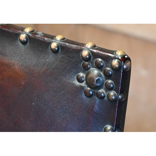 242 - A set of six oak framed brass studded brown leather dining chairs in the 17th century style, compris... 